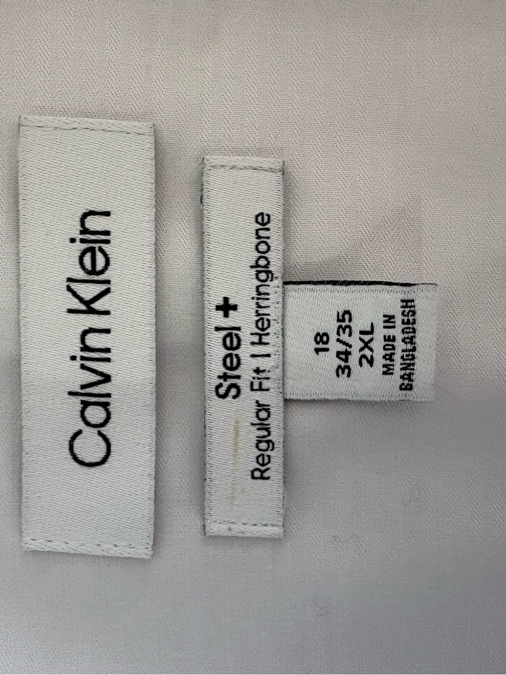 Calvin Klein White Steel+ Regular Fit Herringbone Men’s Jeans Label